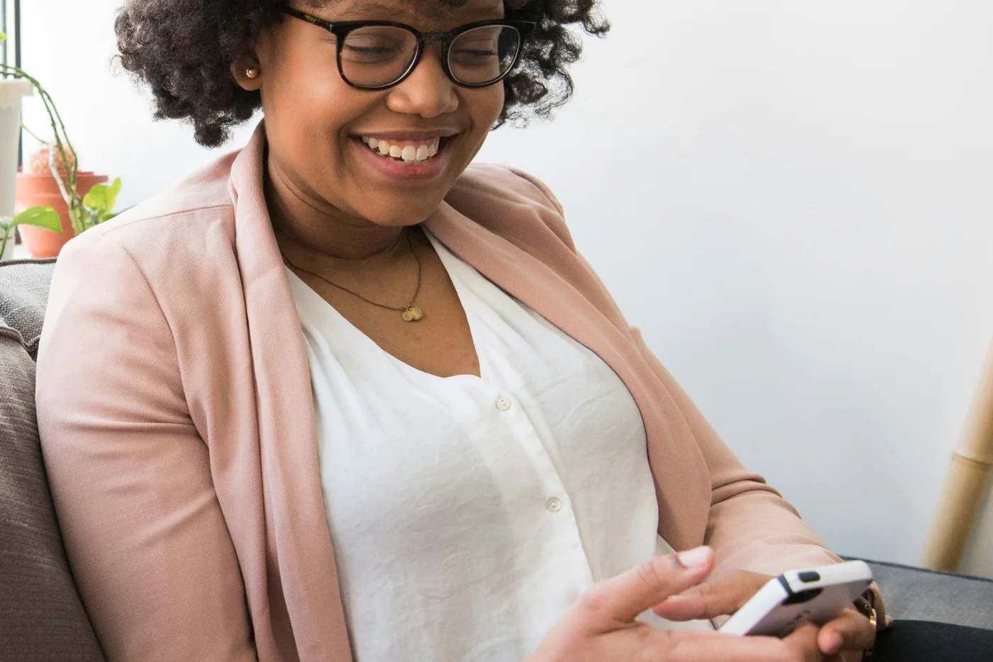 A product professional reviewing a mobile experience on a smartphone